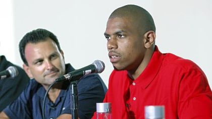 Terrelle Pryor with Ohio State head coach Jim Tressel, who resigned Monday amid allegations that some Ohio State players traded autographs and memorabilia for tattoos and money.