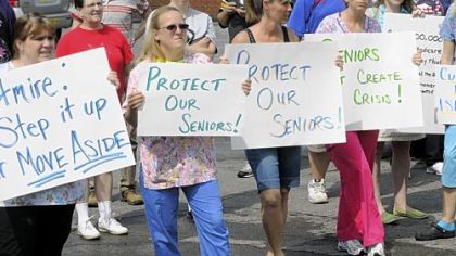 Nurses and health care workers protest Monday outside U.S. Rep. Jason Altmire's office in Aliquippa, urging the congressman to preserve Medicare, Medicaid and Social Security.