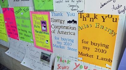 Signs thanking buyers of their livestock are hanging at the Greene County Fair in Waynesburg, Pa. The fair has many energy-related sponsors including EQT Corporation Chevron, Consol Energy and ECA Energy. The 4-H Market sale includes purchases by energy companies.