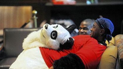 A man takes a break from wearing his costume head Thursday at the Westin Convention Center hotel during Anthrocon 2011, Pittsburgh's annual furry fandom convention at the David L. Lawrence Convention Center.