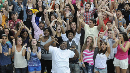 Tim Hall, center in white T-shirt, 20, of North Side was especially enthusiastic during the promotional spot filming.