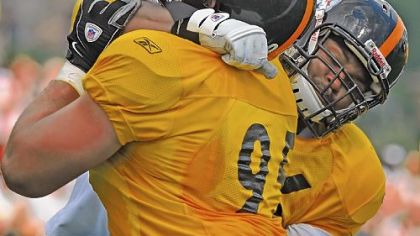 Steelers Cameron Heyward (left) and Ziggy Hood (right) battle during blocking drills during training camp at Saint Vincent College in Latrobe.