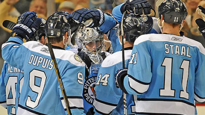 Marc-Andre Fleury is mobbed by teammates Sunday after the Penguins beat the Florida Panthers at Consol Energy Center.