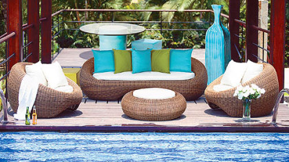 Seasonal Living's ceramics and outdoor furniture creates a chic outdoor environment.