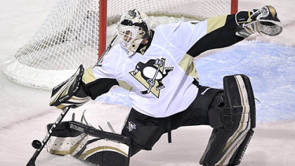Penguins goaltender Brent Johnson deflects a shot during the first period of Thursday's game against the Canadiens at the Bell Centre in Montreal.