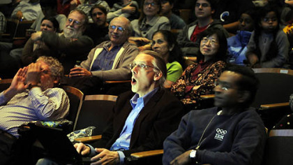 Eric Nyberg, a professor in the Language Technologies Institute at Carnegie Mellon University who worked with IBM developing the computer Watson, watches with a group on campus as Watson competes against people playing "Jeopardy!"