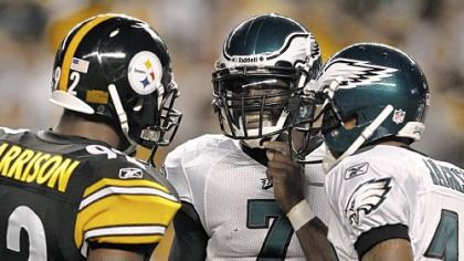 Linebacker James Harrison talks with Eagles quarterback Michael Vick and receiver DeSean Jackson between plays in the second quarter Thursday night.