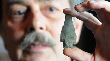 Mike Kotz of Claysville shows a Native American artifact dating back 9,000 years.