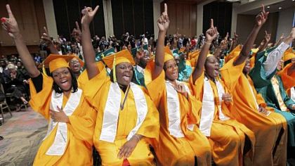 Booker T. Washington High School graduates in Memphis, Tenn., celebrate Monday before receiving their diplomas from President Barack Obama. The first black president said "nothing about the de facto segregation of the public school graduates sitting in front of him."