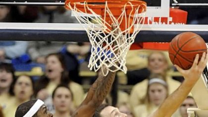 Matt Freed/Post-Gazette
Notre Dame's Ben Hansbrough goes in for a layup against Gilbert Brown in the first half Monday. Hansbrough's big second half helped the Irish knock off No. 2 Pitt, 56-51.