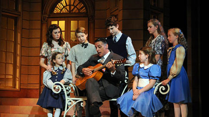 As Captain Von Trapp, Robert Cuccioli, center, shares music with the Von Trapp children in Pittsburgh CLO's "The Sound of Music."