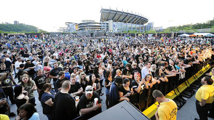 A crowd of about 4,000 attended the Social Distortion concert Wednesday, the first at Stage AE's outdoor venue on the North Shore.