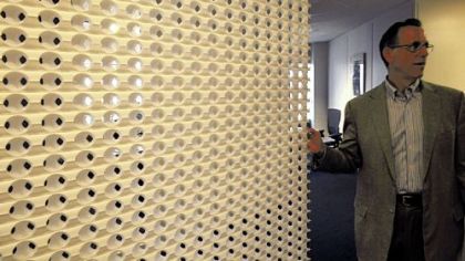 Gary Saulson shows a paper divider that is used to give privacy.