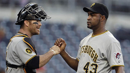 Catcher Ryan Doumit fist-bumps reliever Jose Veras after Veras survived a rocky ninth inning Wednesday at Petco Park.