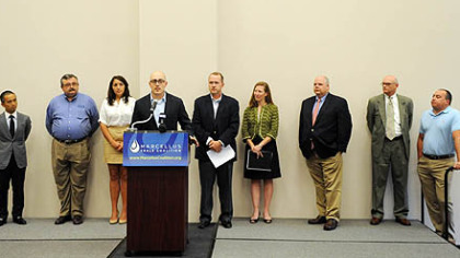 From left, Ko Watanabe of Sumitomo Corporation of America, David French of L.R. Kimball, Lee Ann Wainwright of Chief Oil & Gas, Matt Pitzarella of Range Resources Corporation, Doug Matthews of U.S. Steel, Kathryn Klaber of the Marcellus Shale Coalition, Jack Thompson of Chesapeake Energy, Gregg Troian of PGT Trucking and Jason Norris of Dura-Bond Pipe take the stage as part of a press conference about a new economic impact analysis of Marcellus Shale development in Pennsylvania at the U.S. Steel Mon Valley Works Training Hub in Duquesne, Pa.