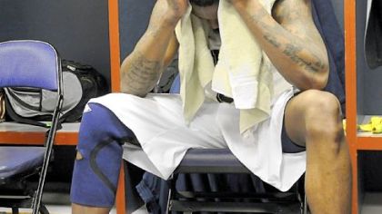 Pitt's Nasir Robinson collects himself in the Pitt locker room in the Verizon Center after Saturday night's heart-breaking loss to Butler. Robinson fouled Matt Howard in the last second.