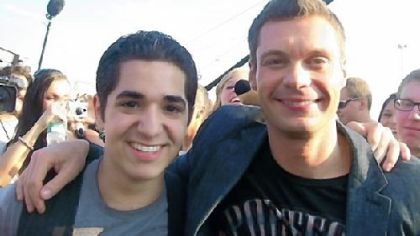 Contestant Rocky Paterra, left, of Upper St. Clair with host Ryan Seacrest.