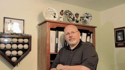 Tony Villiotti, creator of the Draftmetrics website poses for a photo in his Scott home.