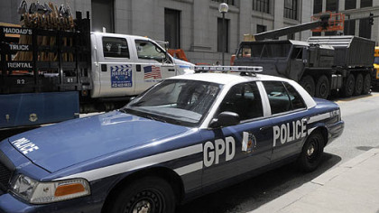 A Gotham City police car and a military vehicle are ready for action along Smithfield Street, Downtown, on Aug. 10.