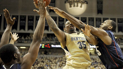Pitt's Nasir Robinson drives to the net against Connecticut's Charles Okwandu during the team's only meeting earlier this season at the Petersen Events Center. Pitt won 78-63. The two teams will meet again tomorrow at noon in the Big East Tournament quarterfinals.