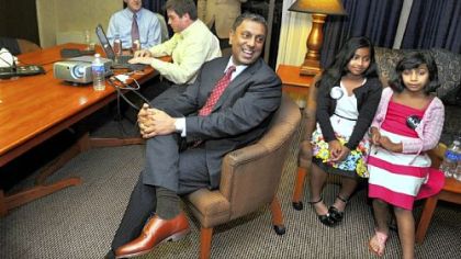 D. Raja's campaign staff works the numbers on election night, when he won the primary vote for the Republican candidate for Allegheny County Executive.  The candidate shares some private time with his daughters Isana, 9, and Omisa, 7.  In the background is Zack Wallen, Mark Harris and Mike Devanney.