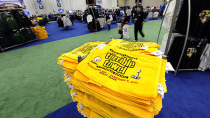 Terrible towels are stacked for sale at the NFL Experience at the convention center in Dallas.