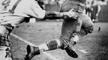 Pitt's Fred Cox (28) intercepts a pass intended for Penn State's Dick Hoak (41) in the 1959 Penn State-Pitt game. Pitt won 22-7.