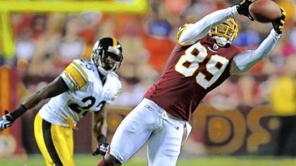 Washington Redskins wide receiver Santana Moss hauls in a pass from quarterback Rex Grossman against the Steelers Friday night tonight at FedEX Field in Landover, Md.