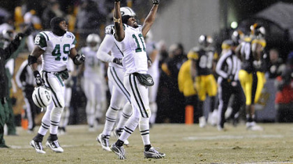 Jets' wide receiver Santonio Holmes celebrates at the end of a 22-17 win at Heinz Field Dec. 19.