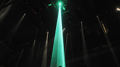Jay-Z opens on a small stage in the center of Consol Energy Center that was raised and then lowered, with a video monitor on the sides.