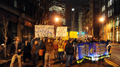 Protesters from Occupy Pittsburgh march from their camp at Mellon Green to the Developing Unconventional Gas East conference at the David L. Lawrence Convention Center on Tuesday.