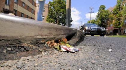 A storm drain in Shadyside at Ellsworth and Negley avenues looks almost completely clogged.