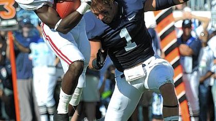 Penn State's Nick Sukay loses his helmet while putting a hit on Alabama's Kevin Norwood Saturday at Beaver Stadium.