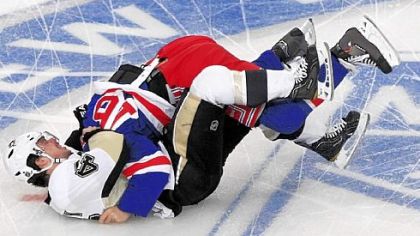 Tyler Kennedy, right, fights New York's Sean Avery just 2:21 into the game Tuesday.