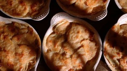 Individual sweet potato gratins with creme fraiche, onions and bacon.