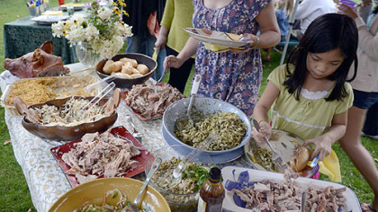 Several friends and neighbors gathered for a pig roast at Gretchen McKay's house.