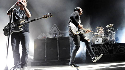 Blink-182 members Mark Hoppus, Tome DeLonge and Travis Barker play to the crowd Thursday night at First Niagara Pavilion in Burgettstown.