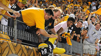 Wide receiver Antonio Brown provides a new twist to celebrating with the crowd after scoring a touchdown in the second quarter Saturday night at Heinz Field. Brown finished with four receptions for 137 yards and two touchdowns.