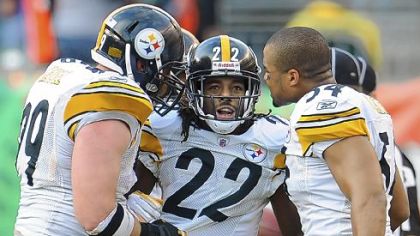 William Gay celebrates with Brett Keisel and Chris Carter after intercepting a pass against the Bengals in the fourth quarter Sunday in Cincinnati.