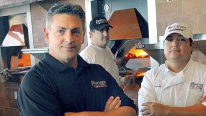 From left, general manager John Mowod and managers Jay Petroy and Carlos Trivelli of Anthony's Coal Fired Pizza in Robinson. The restaurant opens Saturday.