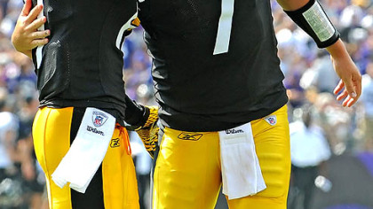 Ben Roethlisberger hugs Mike Wallace after throwing a touchdown pass against the Ravens Sunday in Baltimore.