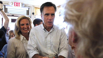 Former Massachusetts Gov. Mitt Romney, center, who is a sixth-generation member of the Church of Jesus Christ of Latter-day Saints, and his wife, Ann, left, at a campaign stop at Robies Country Store, in Hooksett, N.H., Monday.