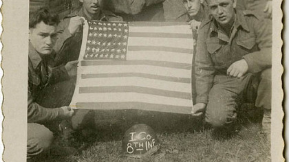 The father of WQED's Chris Fennimore, Joseph Fennimore (kneeling, second from left) was a U.S. soldier in WWII. He and members of his unit created a U.S. flag from found material in Germany.
