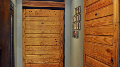 Melissa and Stephen Neely of Point Breeze reused old freezer doors as hanging barn doors.