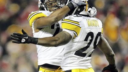 Ryan Mundy, right, celebrates his interception -- one of three against Chiefs quarterback Tyler Palko -- in the first half Sunday