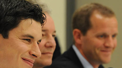 Sidney Crosby, left, talks to reporters accompanied by Penguins General Manager Ray Shero, center, and Director of the UPMC Sports Medicine Concussion Program Dr. Michael Collins.