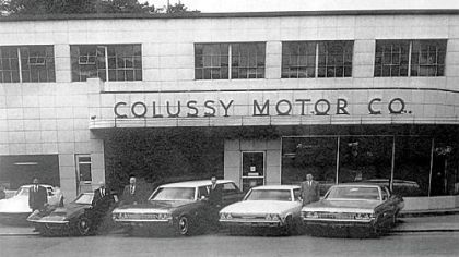 Standing outside the New Colussy Motors Dealership built in 1953.