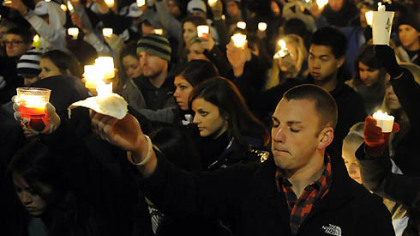 Penn State students gather at Old Main Friday night for a candlelight vigil for the victims of the sex abuse scandal.