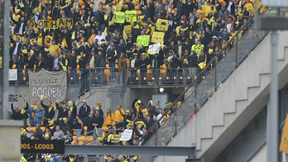 "Fans" cheer at Heinz Field during a football game between Gotham and Rapid City.