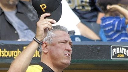 Manager Clint Hurdle doffs his cap to the crowd at PNC Park last Sunday during the final home game of the season -- his first as manager.